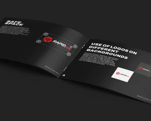 Close-up of the Rapid One Lending brand guide and design documentation in a black and white booklet.