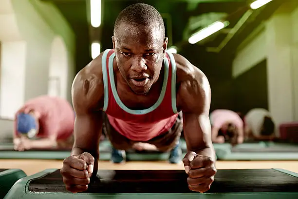 an image of a man doing planks