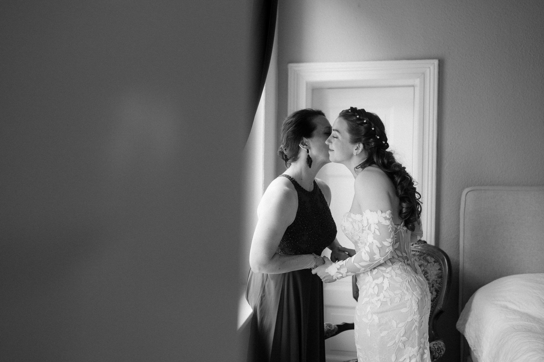 bride mom helping her get ready