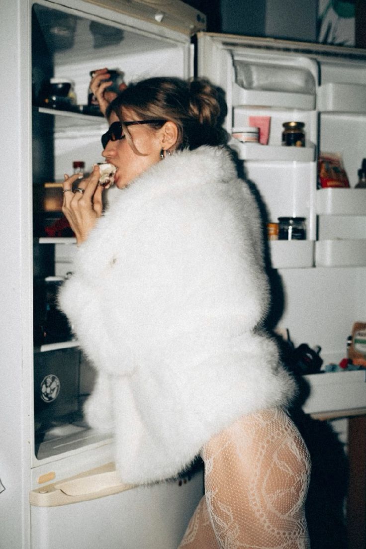 Silhouetted band members play instruments in a smoky warehouse, backlit by vibrant orange and teal lights, creating a moody, dramatic ambiance.