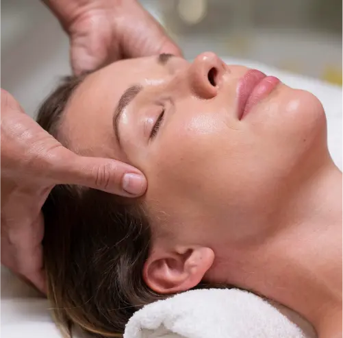 a woman getting a back massage in a spa