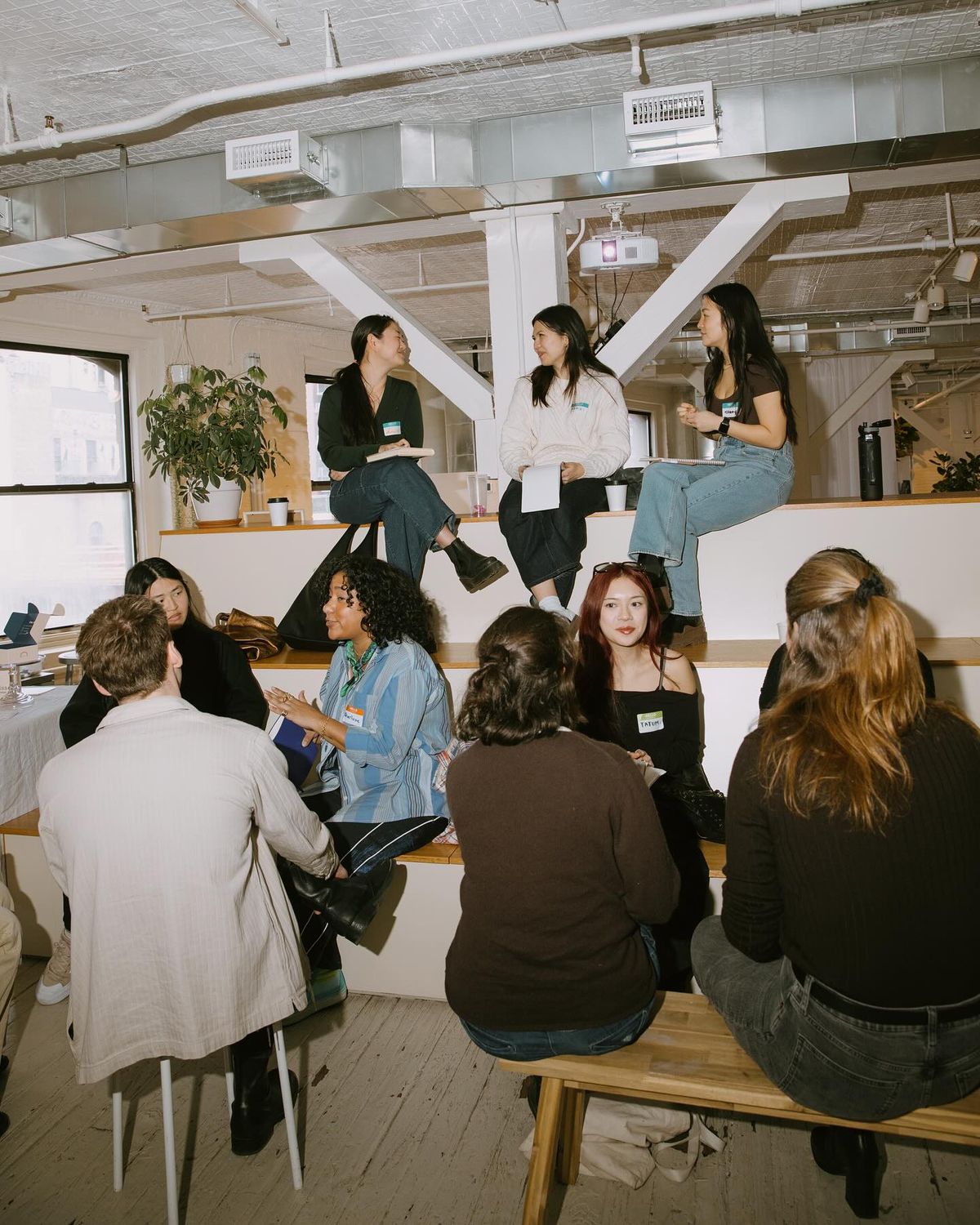 man in black and red shirt reading book