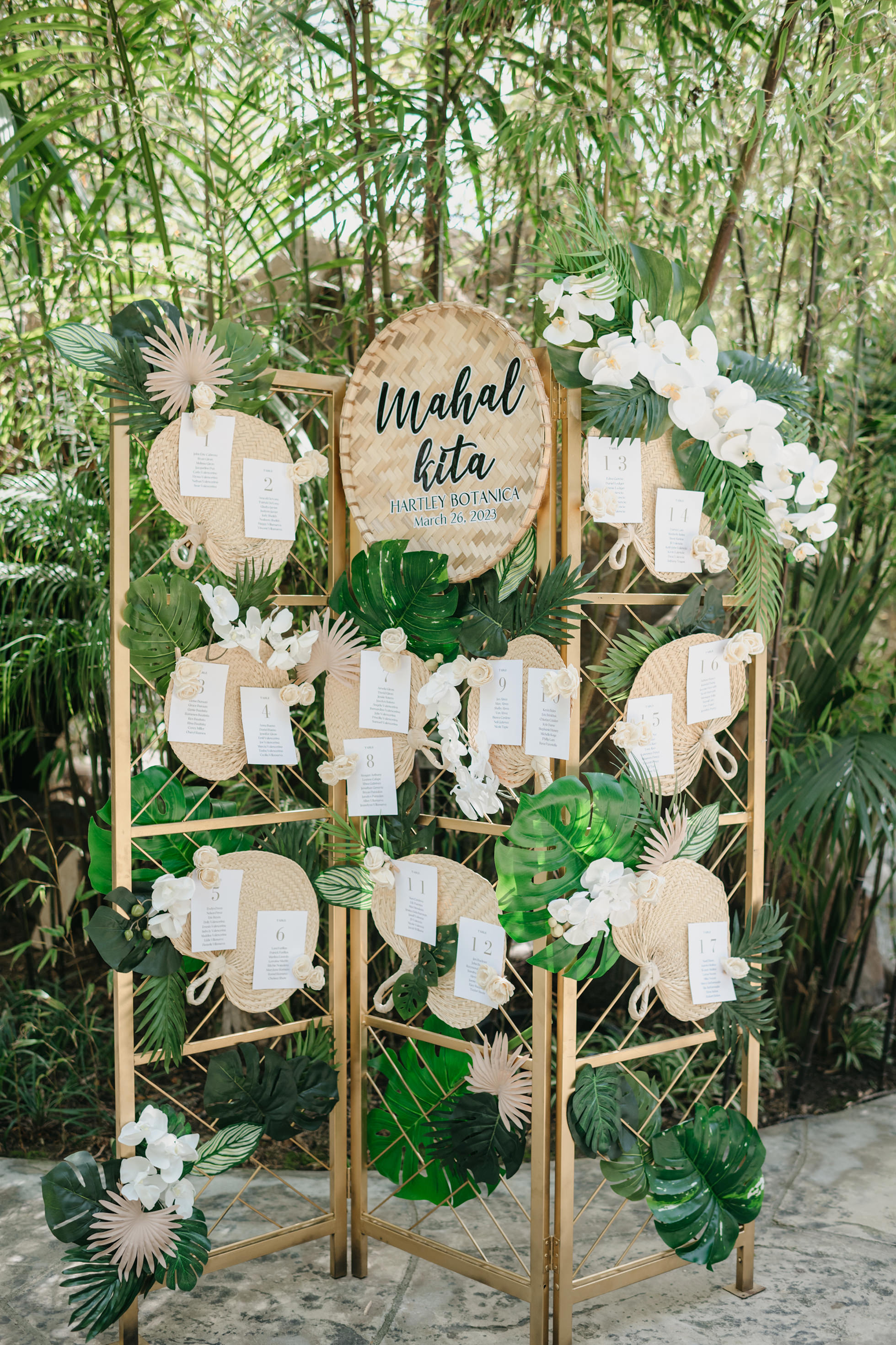 Flat lay wedding details with bouquet, rings, and sparkling bridal heels