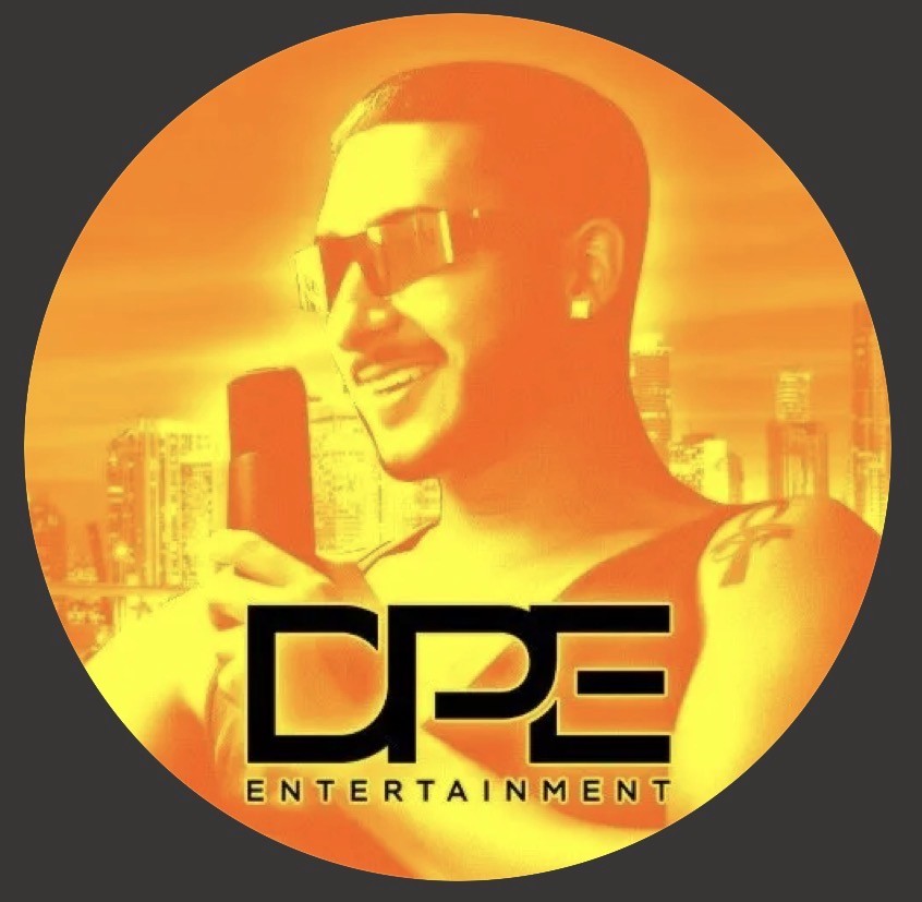 Woman in sunglasses poses against vibrant red background, wearing a beige blazer and black top. Sunlight casts dynamic shadows, creating a stylish, confident mood.