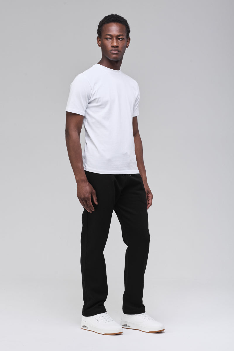 Male model wearing black Langley sweatpants, full figure