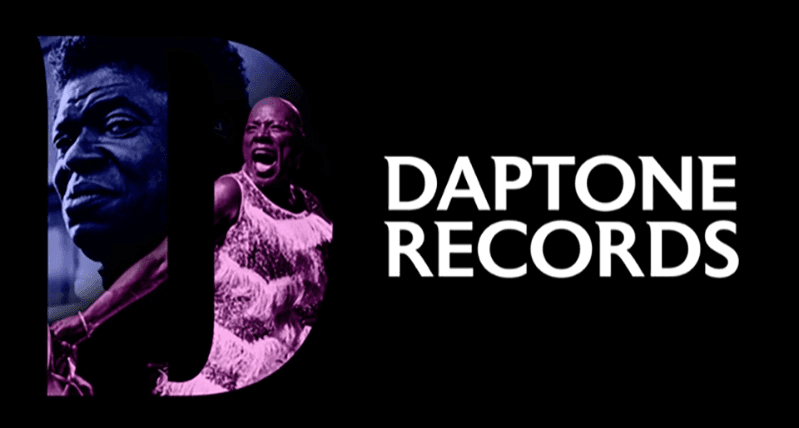 A golden vinyl record cover design featuring a prominent letter "D" and decorative stripes, alongside an image of a vinyl disk.