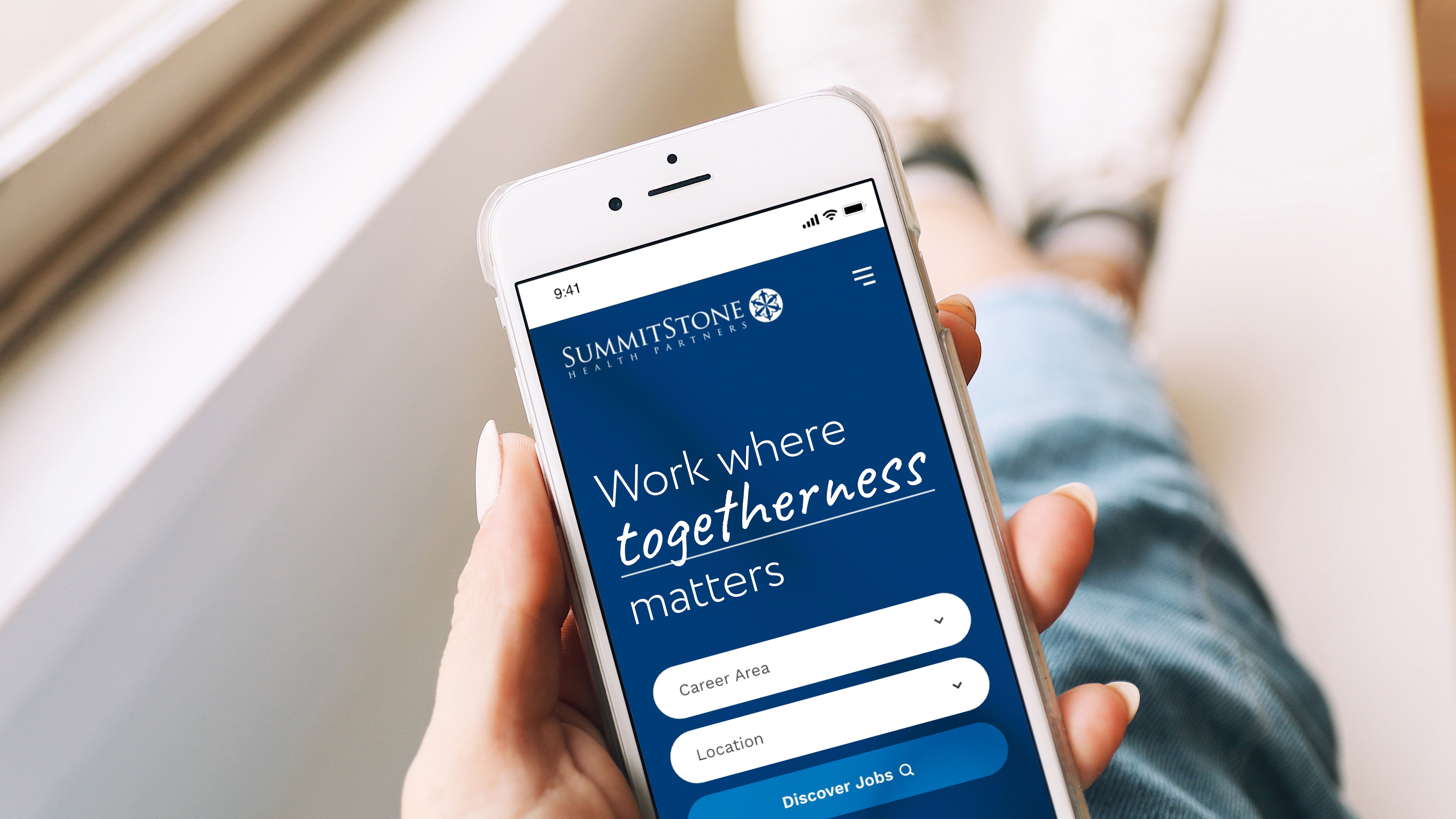 Smartphone displaying SummitStone Health Partners job search app.