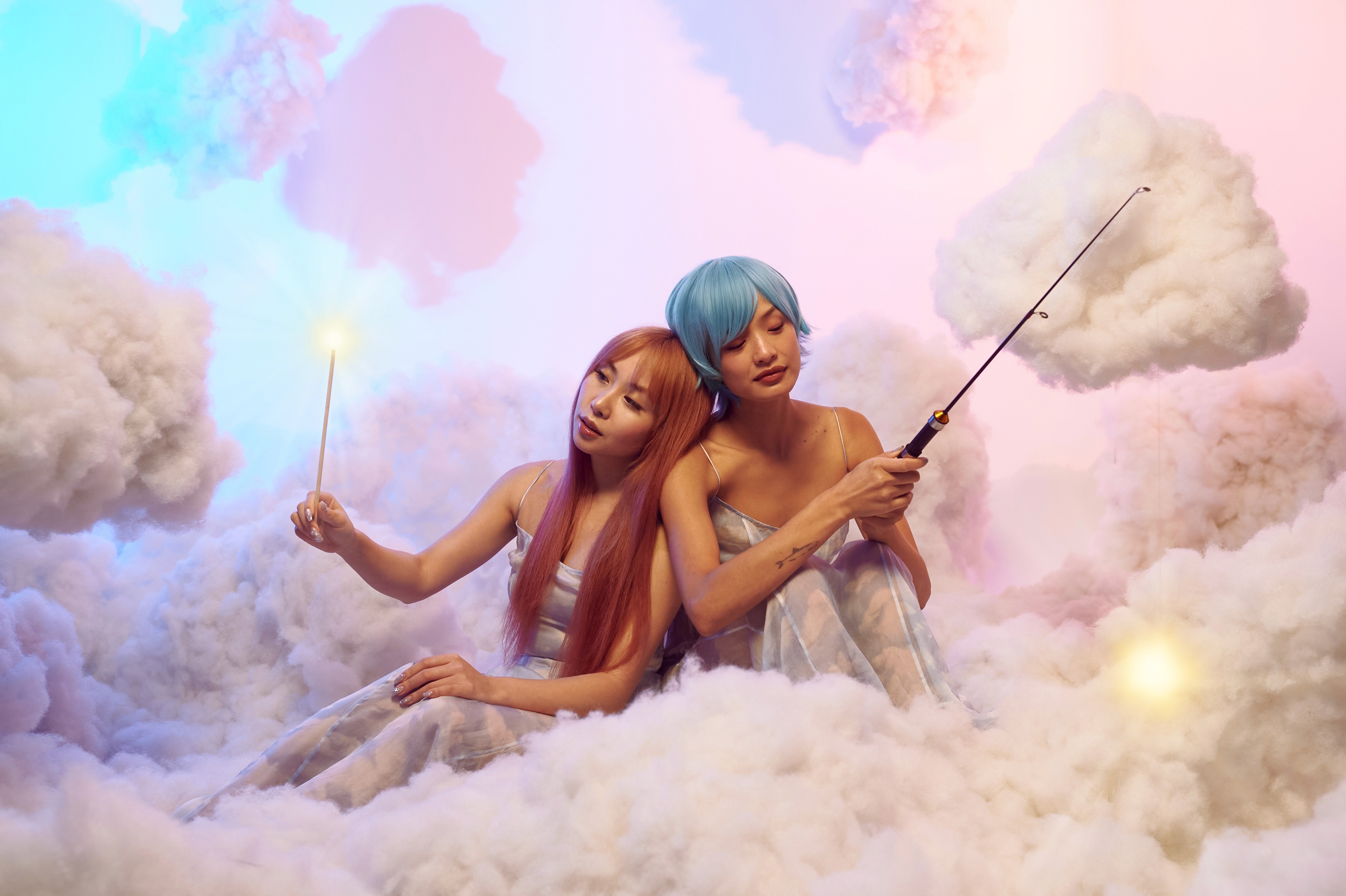 A model surrounded by photographers holding cameras