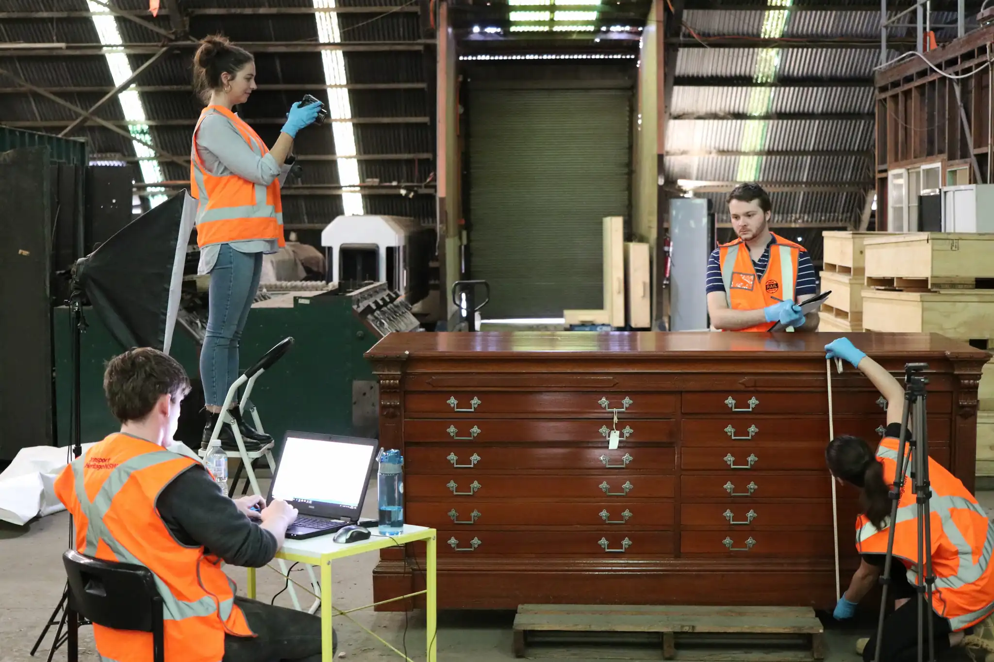 Interns assessing objects at the Igloo in Chullora