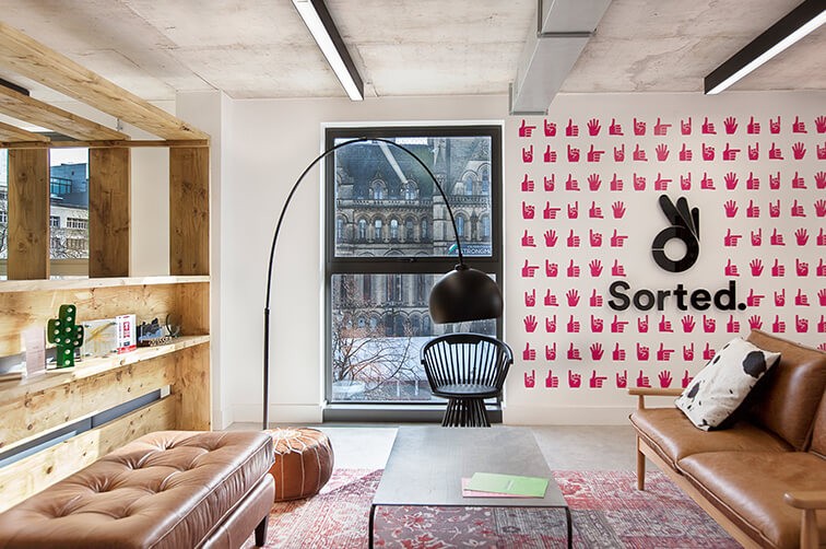 Modern office reception with Sorted logo on the wall