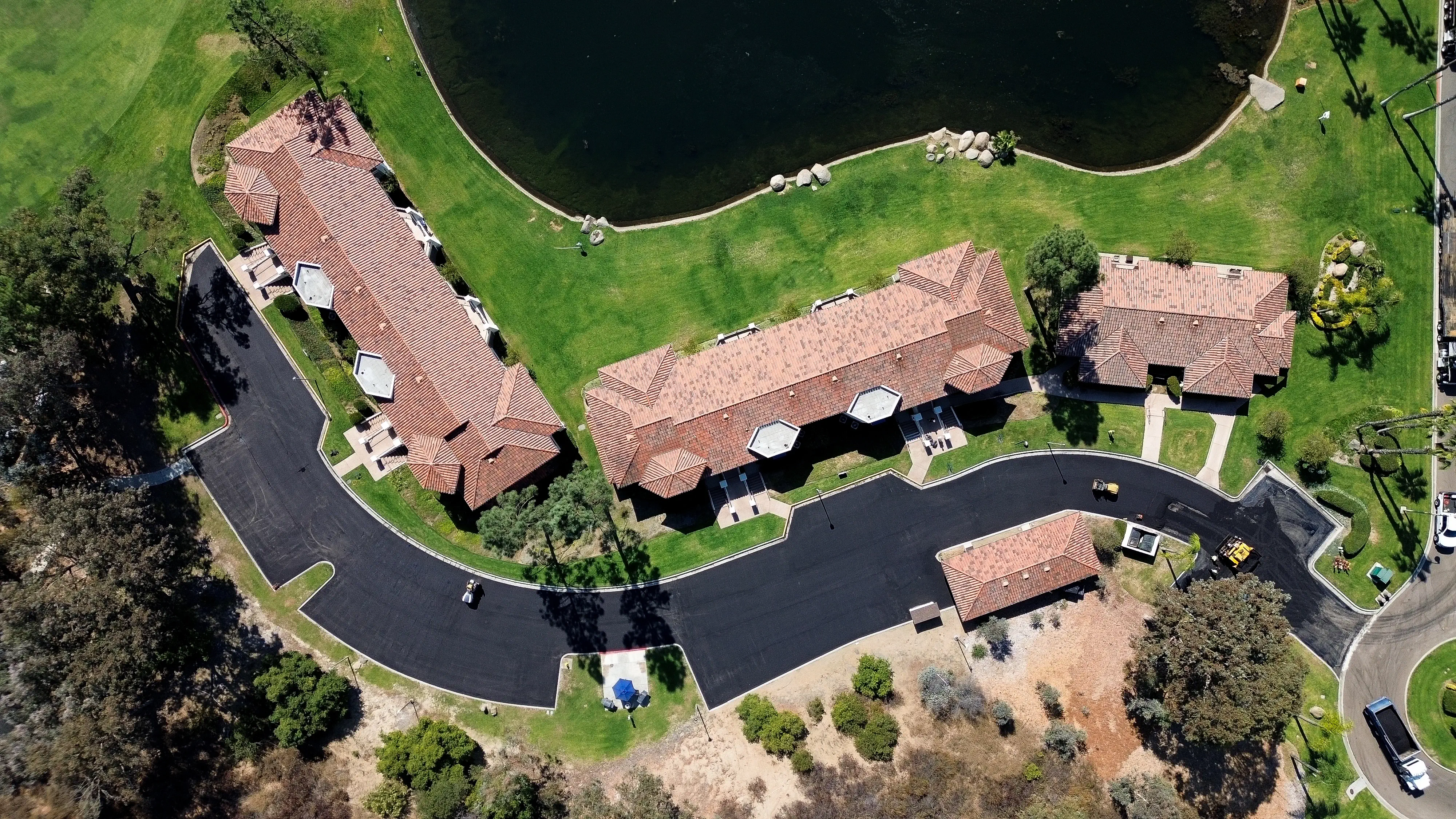 Aerial drone photo of freshly paved HOA parking and streets pavement