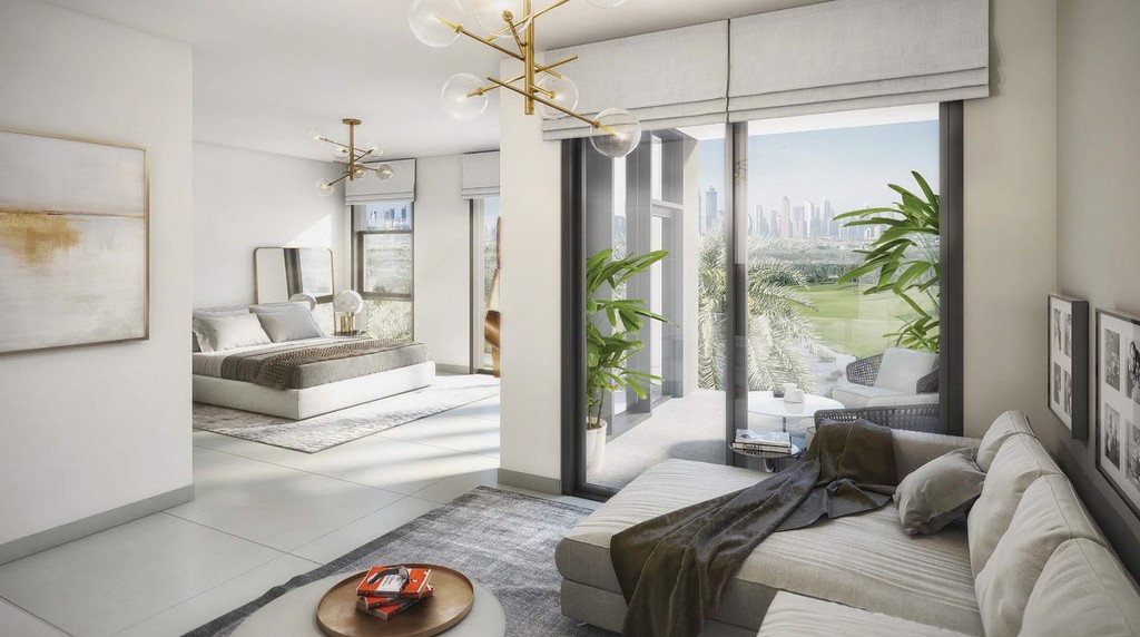 A contemporary living room in Club Villas, highlighted by large windows offering a beautiful sea view.