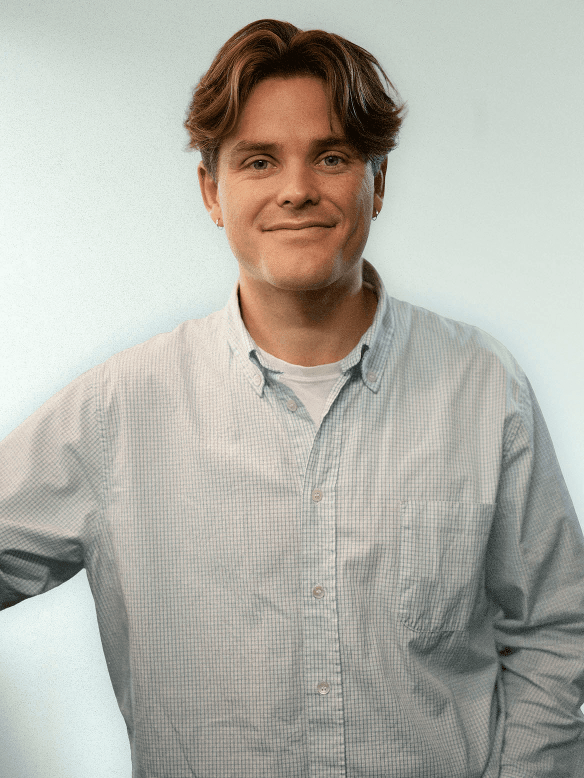 man standing beside wall