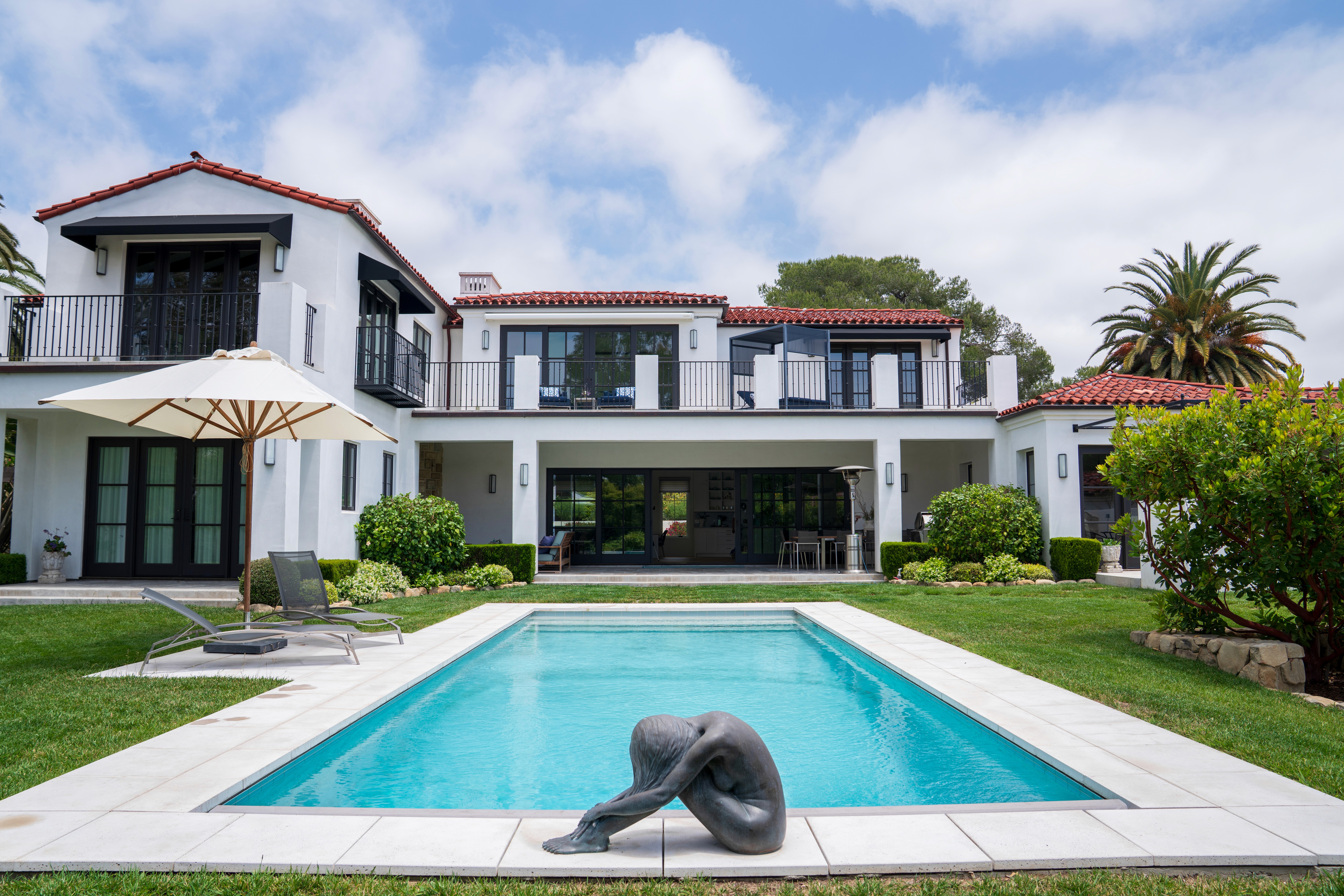 Modern curved staircase with warm ambient lighting