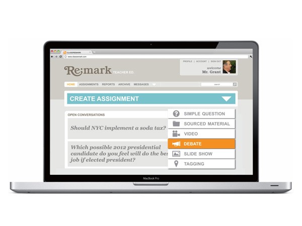 A silver MacBook Pro laptop displays a webpage titled “ReMark TEACHER ED.” at the top. The page includes navigation links for “HOME,” “ASSIGNMENTS,” “REPORTS,” “ARCHIVE,” and “MESSAGES.” A “CREATE ASSIGNMENT” button is visible, along with a “SIMPLE QUESTION” button, a “SOURCED MATERIAL” button, a “VIDEO” button, and an orange “DEBATE” button. A question asks, “Which possible 2012 presidential candidate do you feel will do the job if elected president?” A profile picture shows a man named Mr. Grant.
