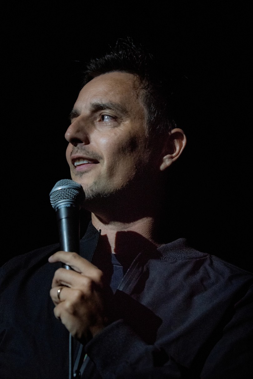 Joe Latham Performing With A Microphone