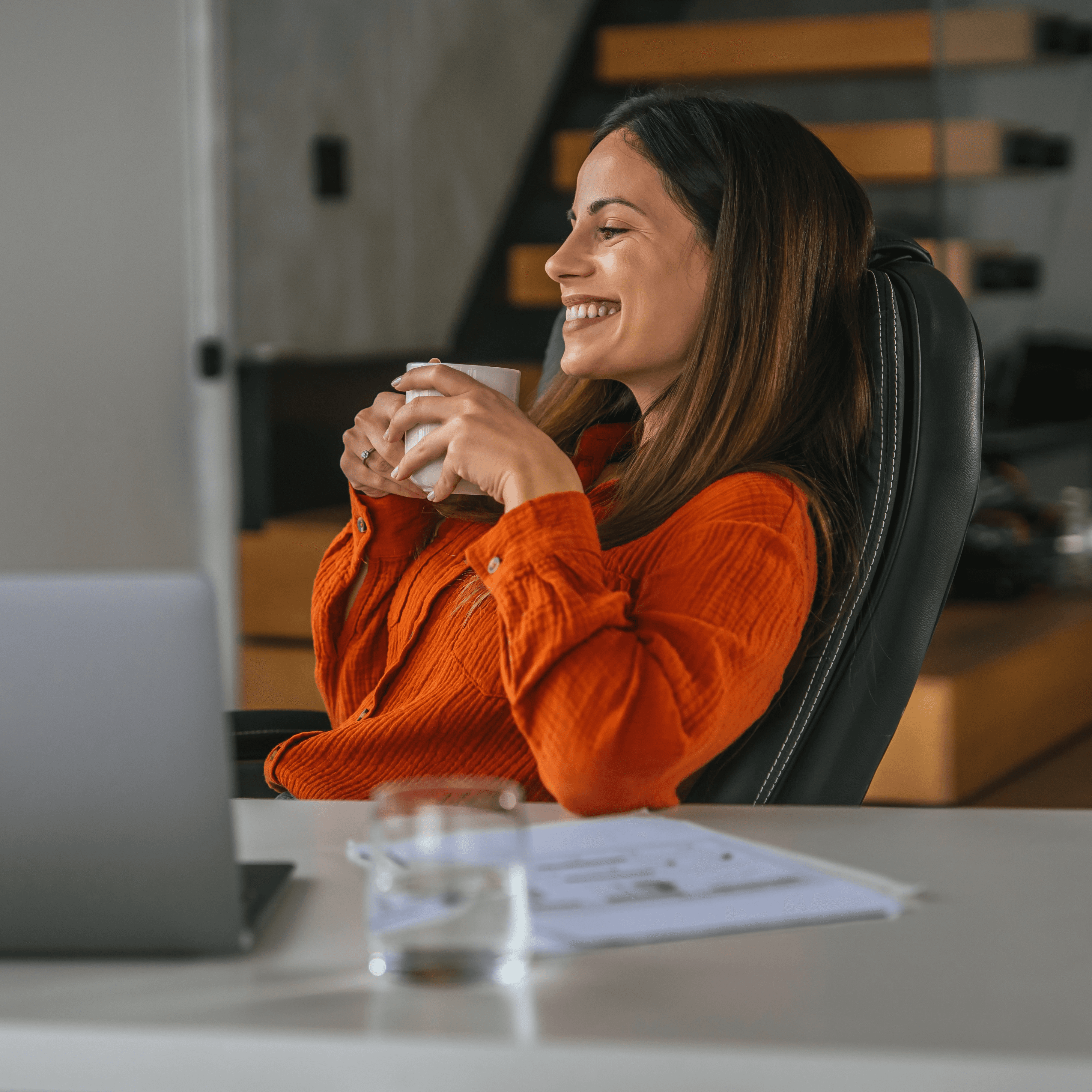 Woman wnjoying coffee at desk