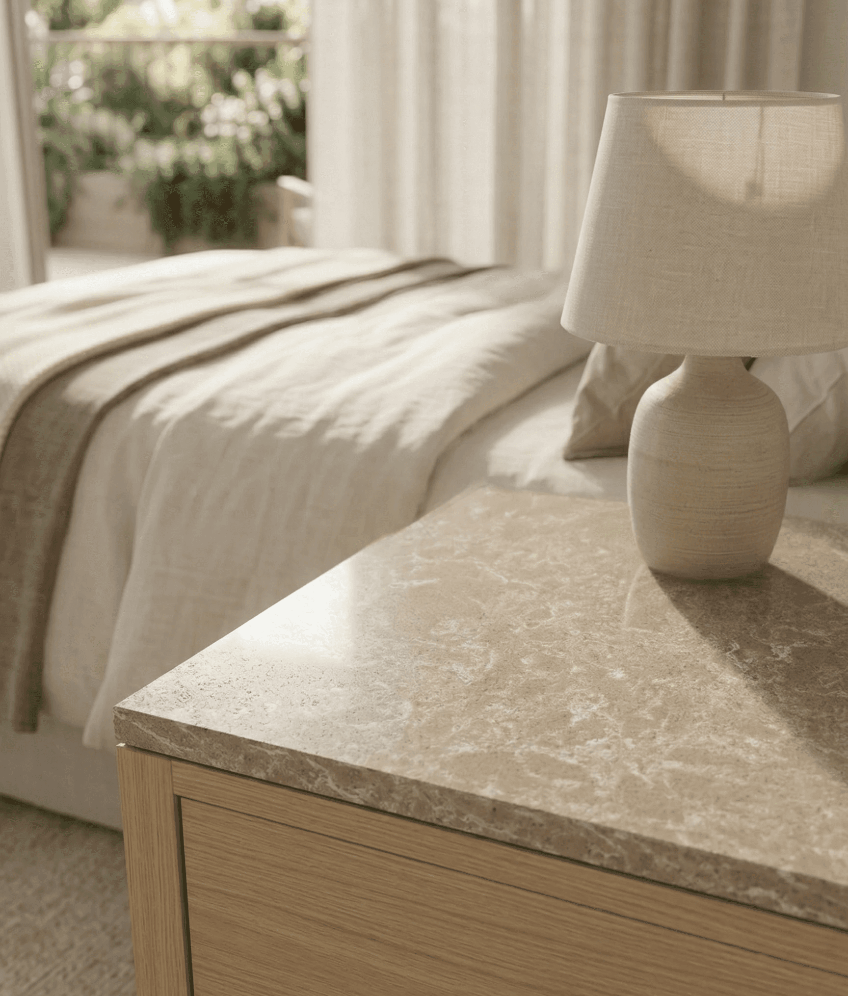 a bedside stone table top in a hotel room