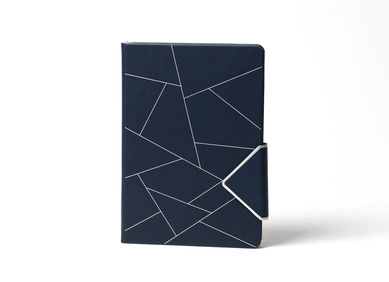 Front view of navy journal featuring abstract geometric line design