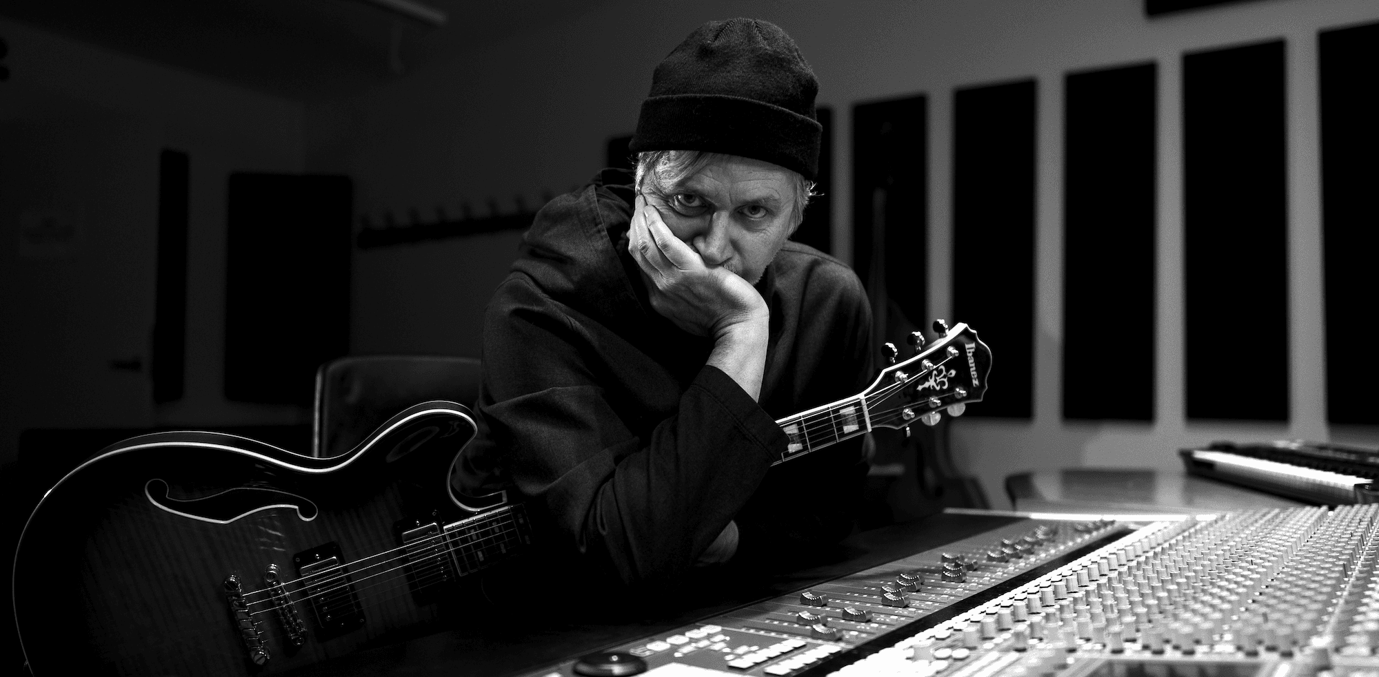 Music Producer sitting at his desk