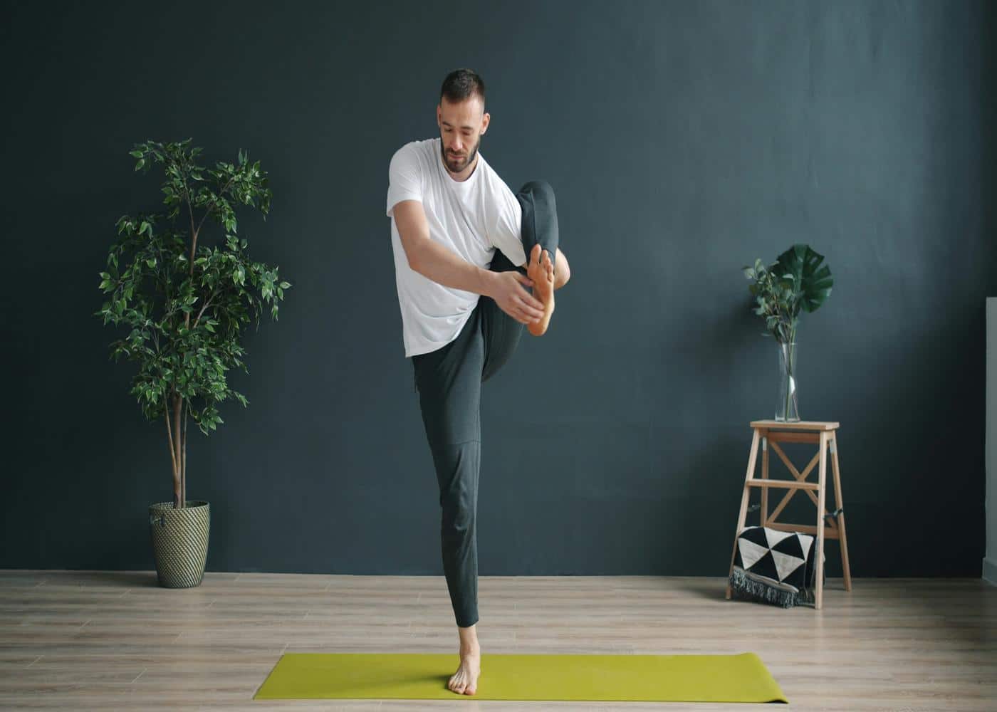 Yoga flexibility routine - Man stretching his hamstring