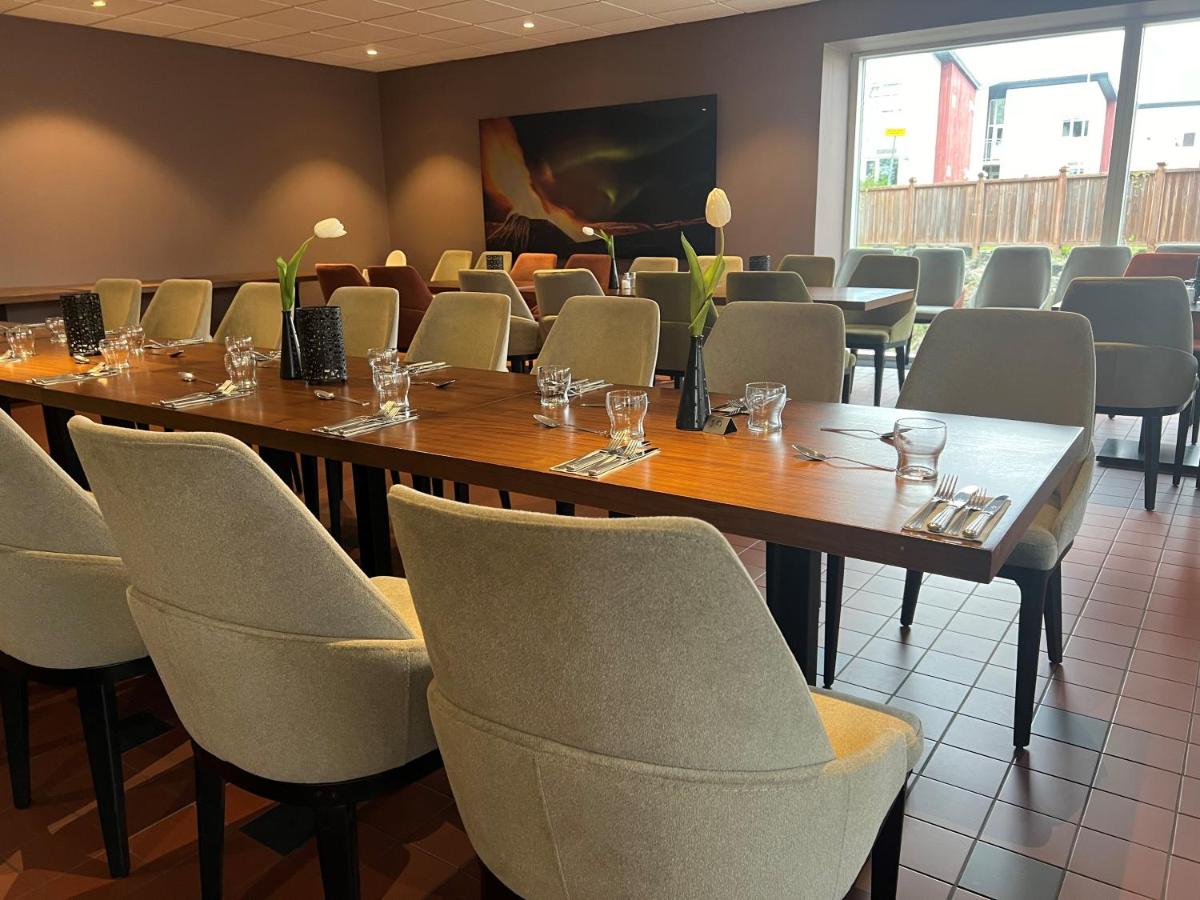 Hotel Bifröst restaurant interior with wooden tables and warm lighting