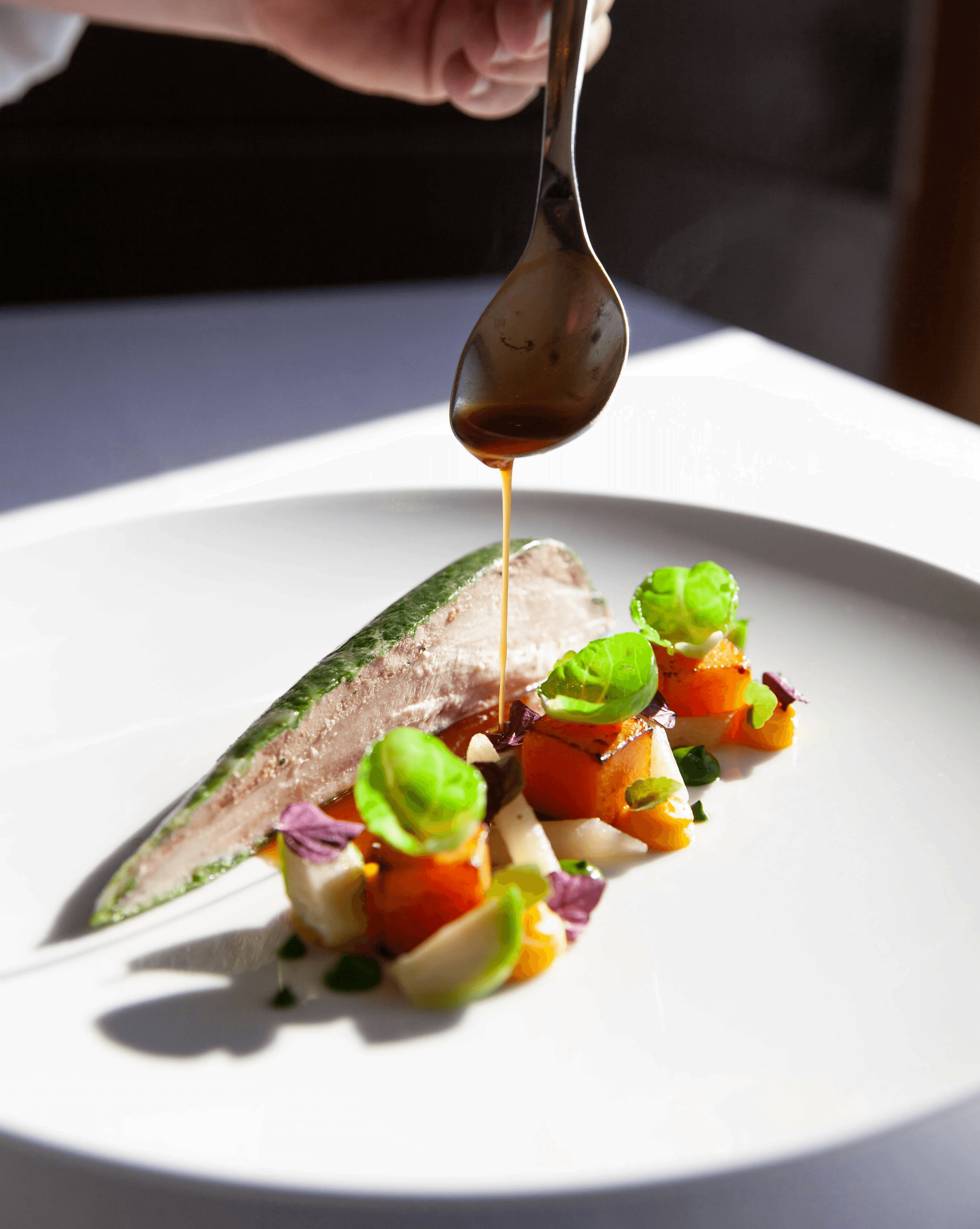 person holding stainless steel spoon