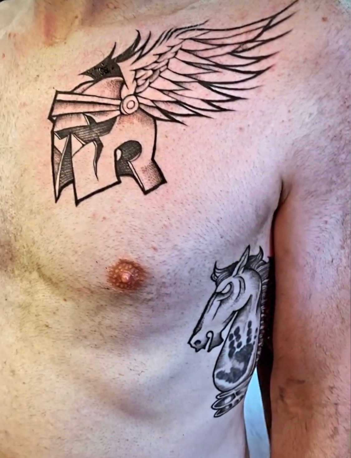 Helmet & Wings tattoo by Mario Ink Chicago