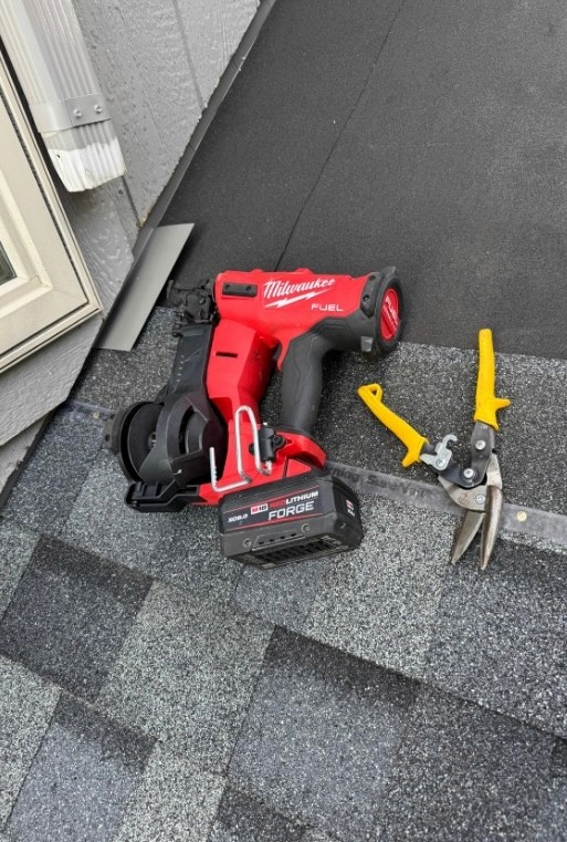 Repairing roof flashing and shingles where there was a roof leak. Project in Shawnee, KS