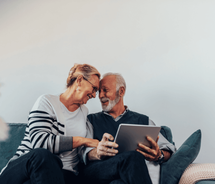 woman standing on rock facing forest