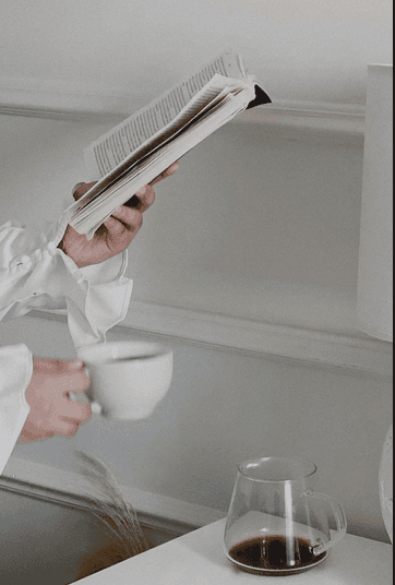 Macro of clear effervescent bubbles in water on a soft gray background—sparkling, minimal texture for clean skincare aesthetic.