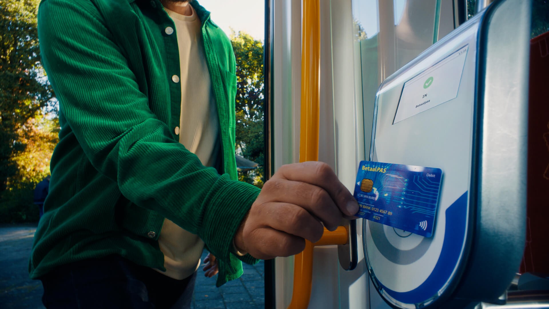 OVpay Commercial Still - Closeup of debit card scanned on a validator