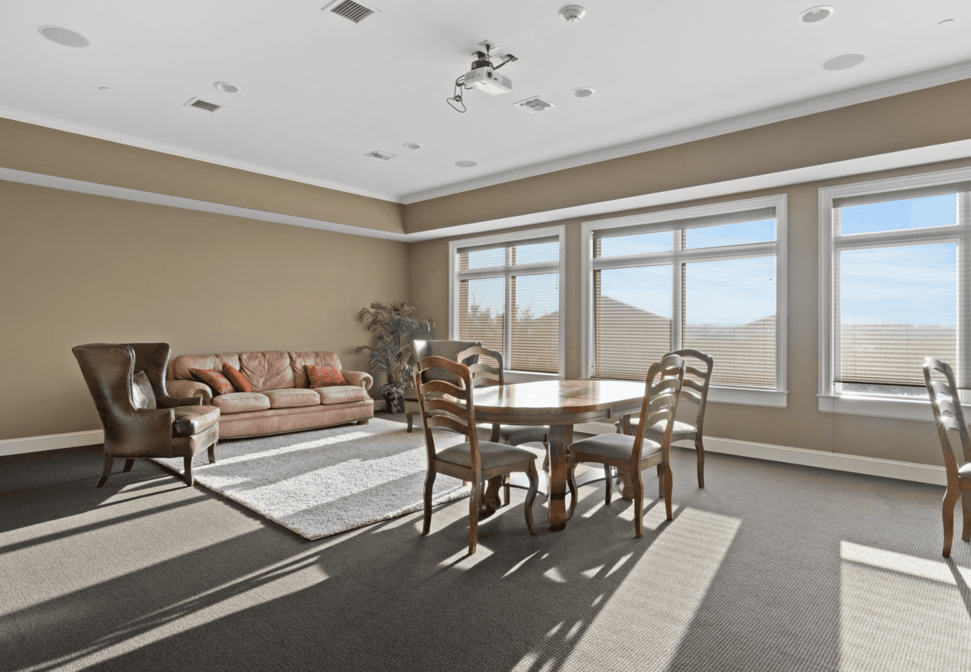 Modern clubhouse interior at The Gateway Village in Murfreesboro featuring a bright dining area, lounge, and natural light.
