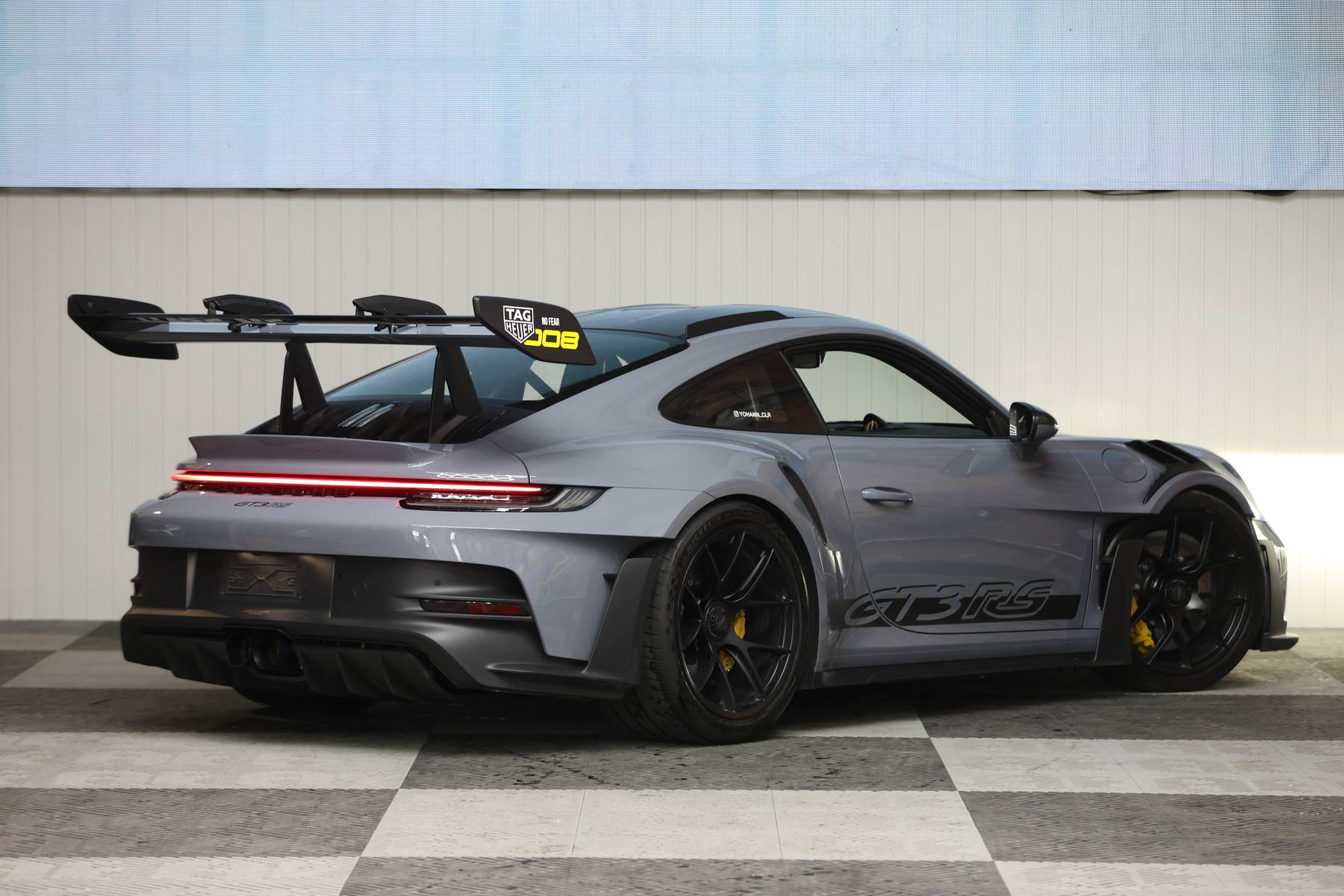 Rear view of a sleek sportscar, ideal for highlighting car rental style and design