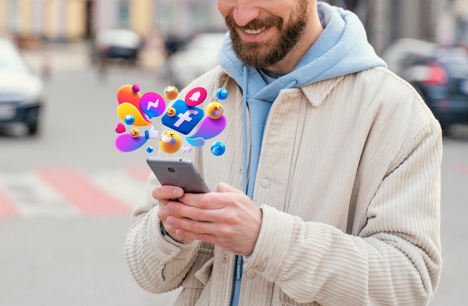  A man smiles while holding a smartphone, showcasing a moment of joy and connection through technology.