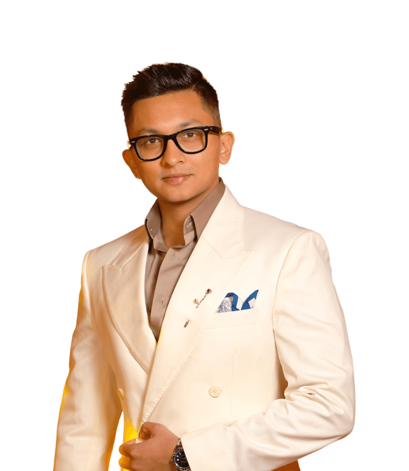 Portrait of Varun Patel, founder and CEO of Neure, wearing a white suit.