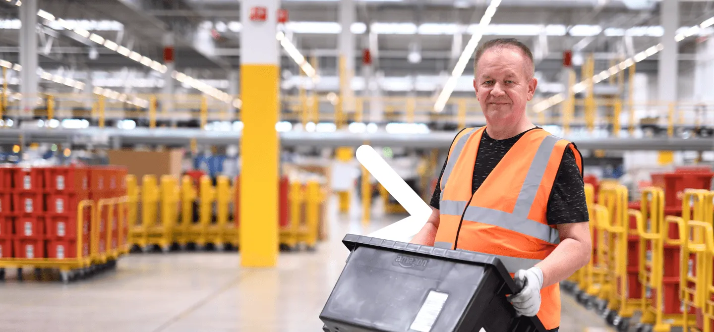 Amazon logistics warehouse employee in safety vest operating in modern fulfillment center with organized inventory system showcasing professional warehouse role, safety standards, and career opportunities in logistics sector - employer branding and talent acquisition campaign repositioning warehouse positions as credible career paths following negative media coverage, strategic communication by Alessandro Brancati Marketing & Growth Studio via Adecco