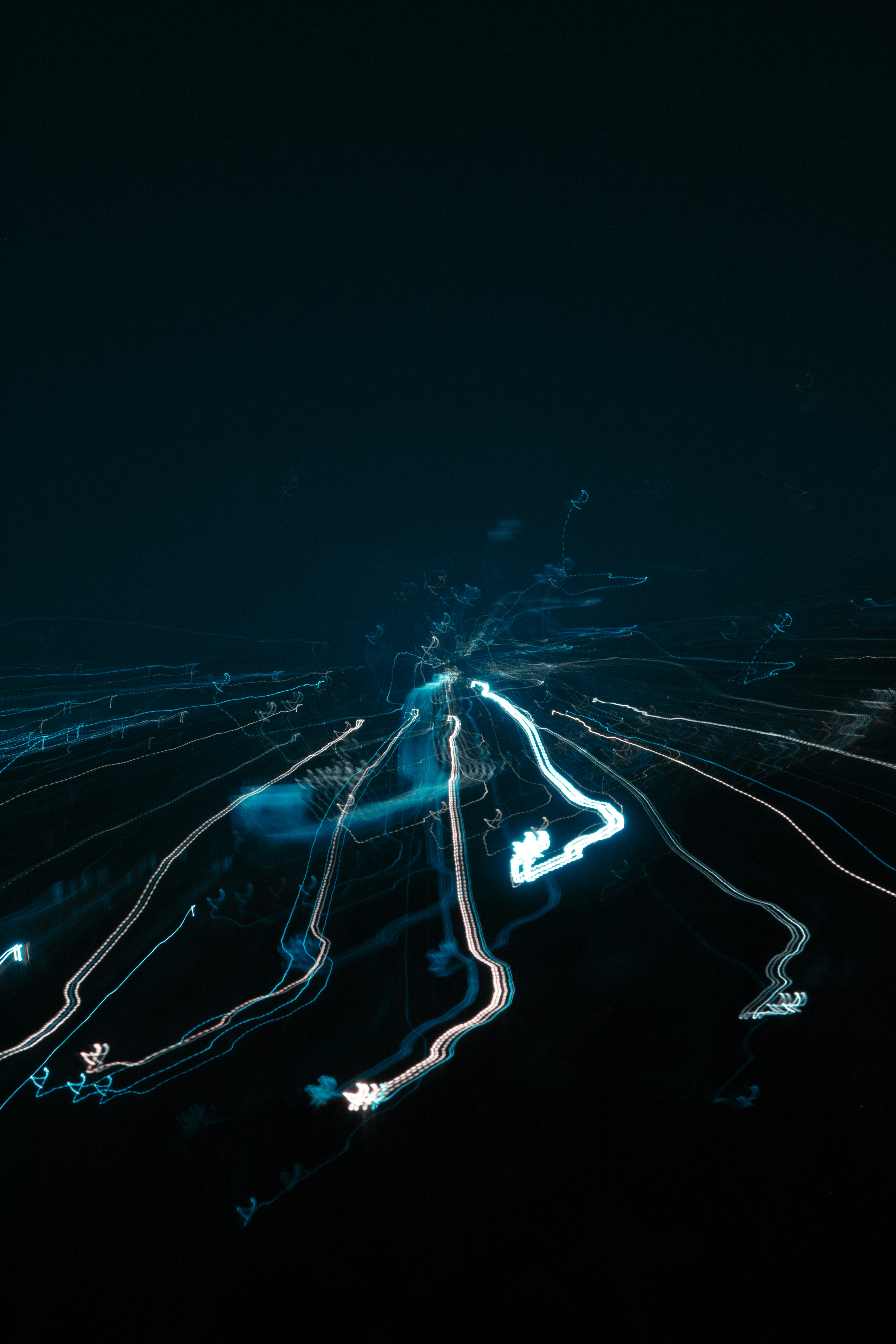 Light trails radiate from a central point.