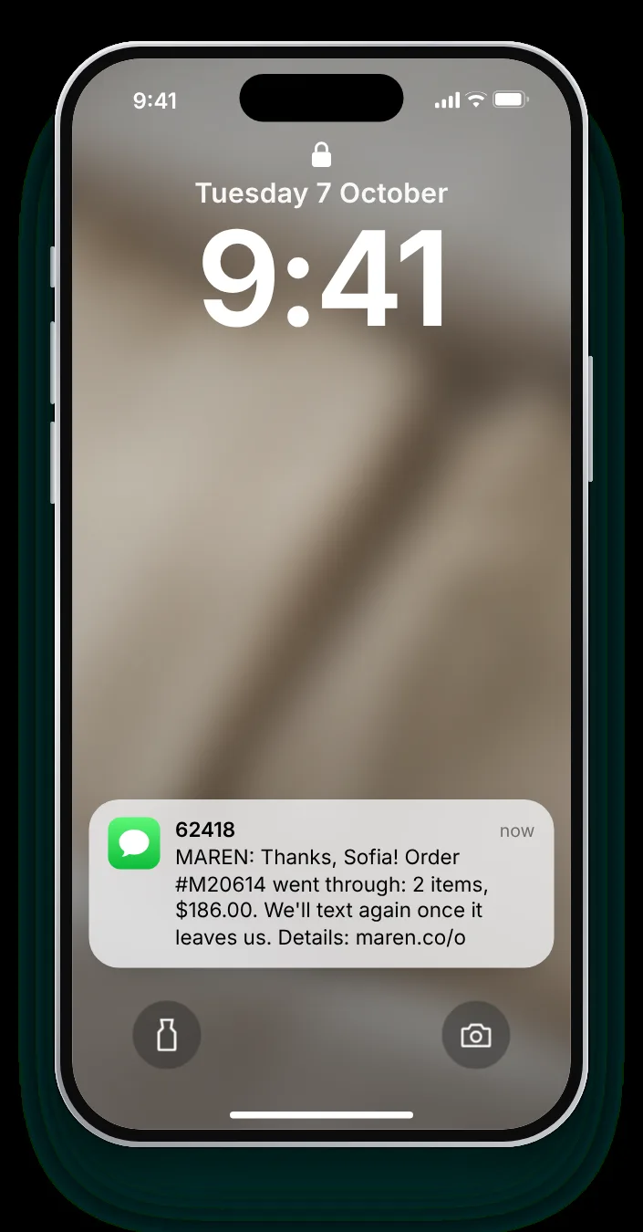 An order confirmation text as a notification on an iPhone lock screen