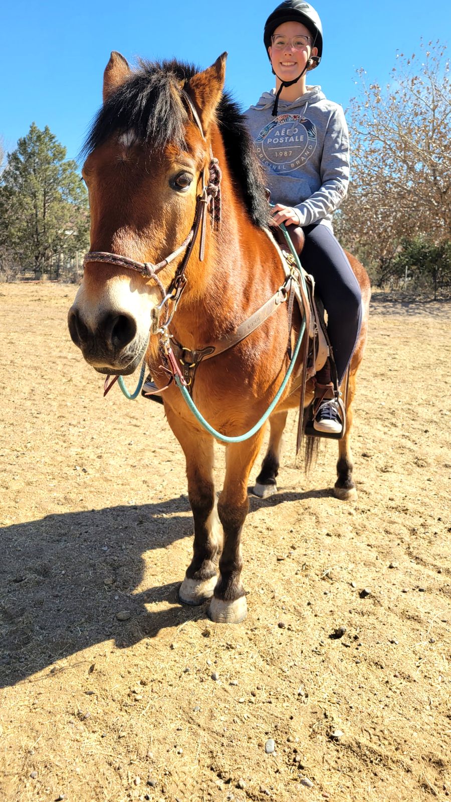 Eden on a trail ride at Enchanted Equine Adventures