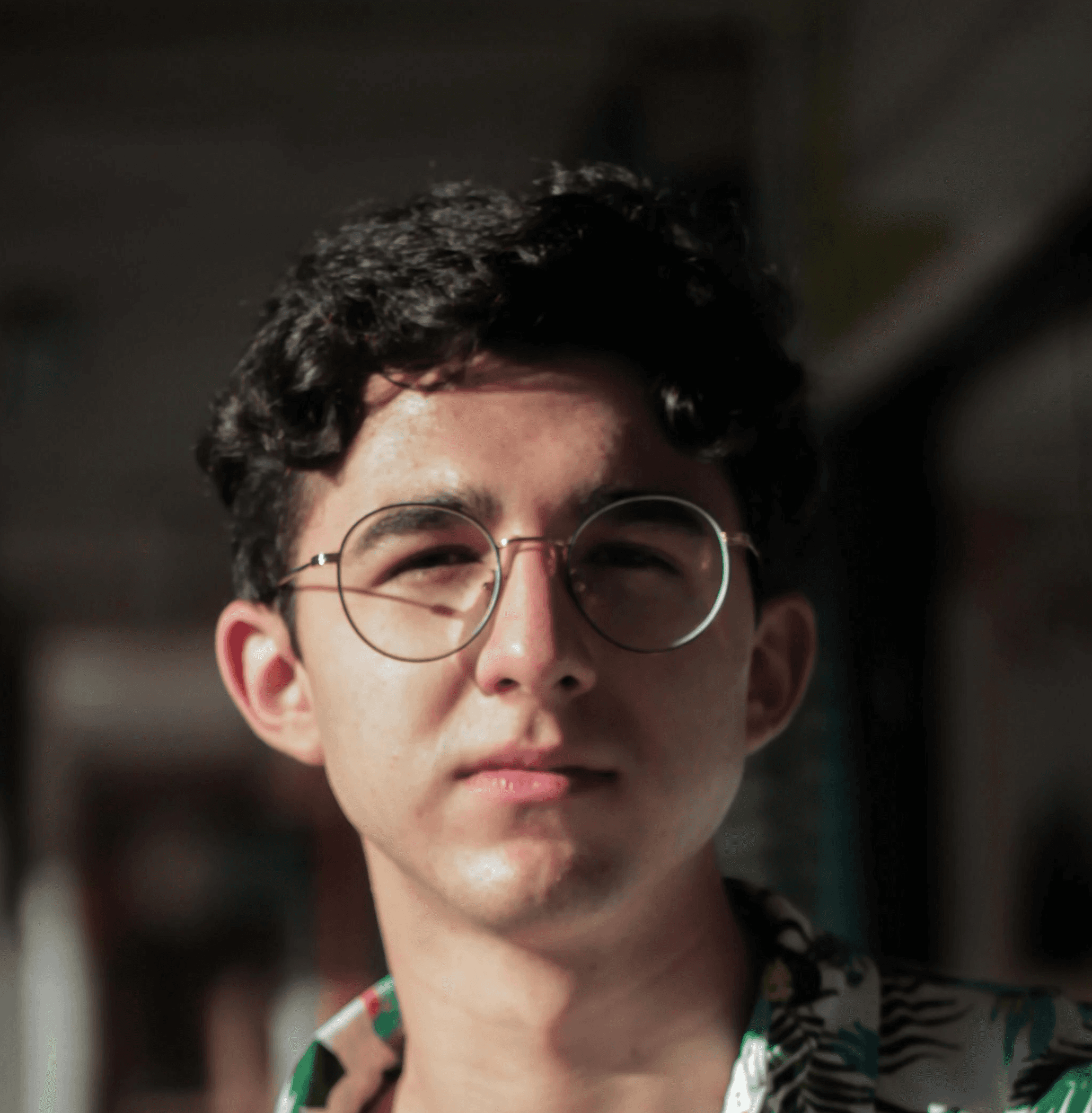 a woman standing on a pier next to the ocean