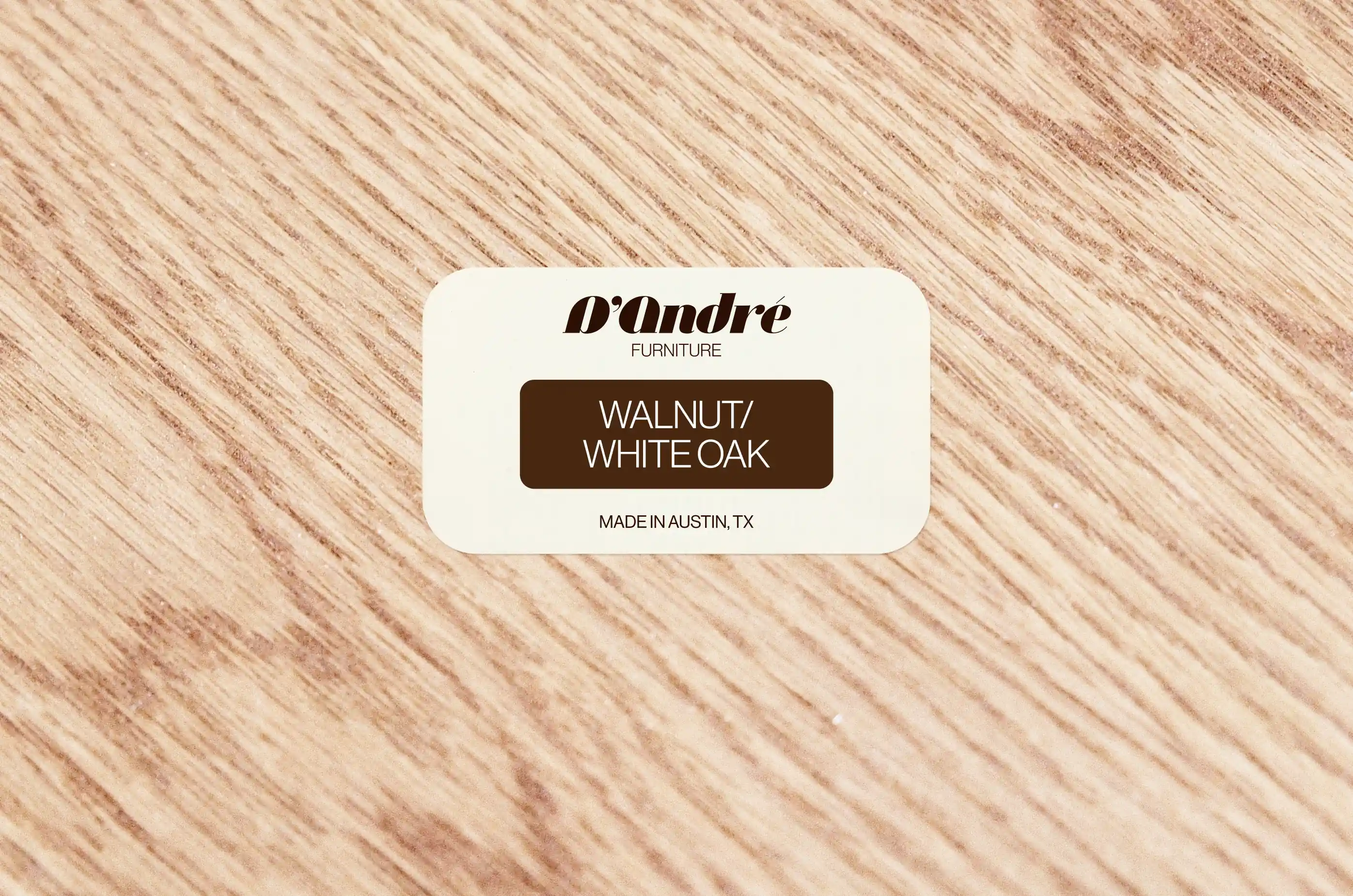 D’Andre Furniture — Logo sticker on underside of custom wooden table — Product branding
