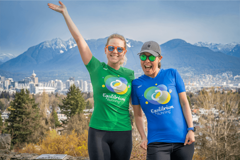Coach Suenaga and a runner posing for a photo