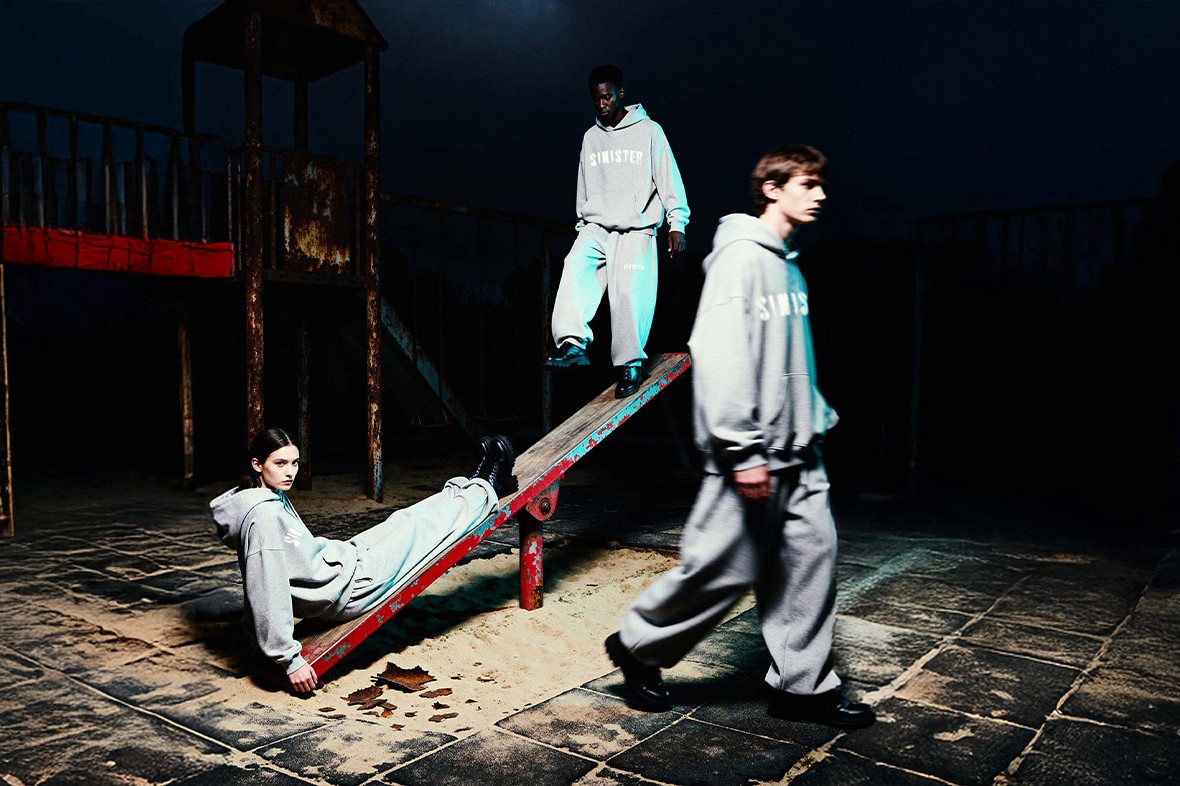 Two models in gray oversized outfits at night playground, Youth Distortion streetwear photoshoot by Sinister J.Y.S.