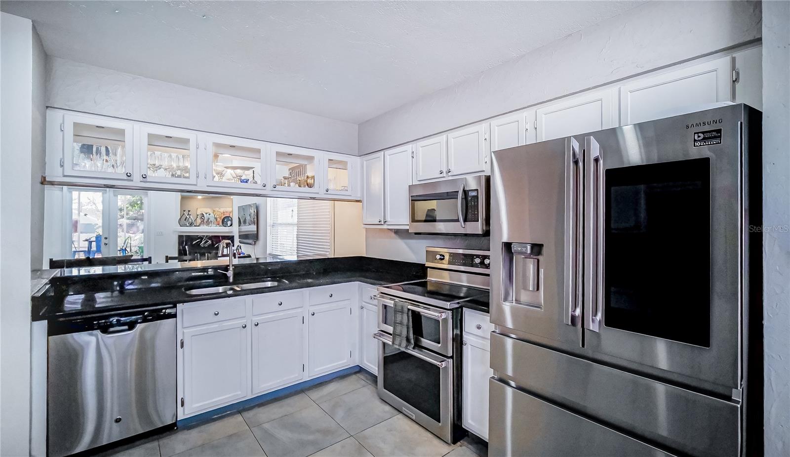 Orlando home interior, kitchen with solid wood cabinets, open living space Orlando, Florida home kitchen
