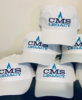 green grass field under rainbow