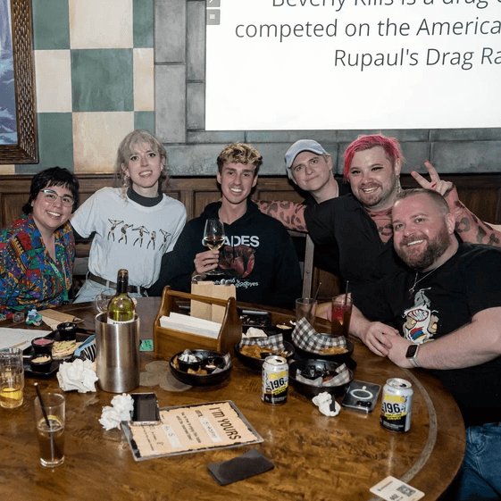 team of friends at trivia posing for camera