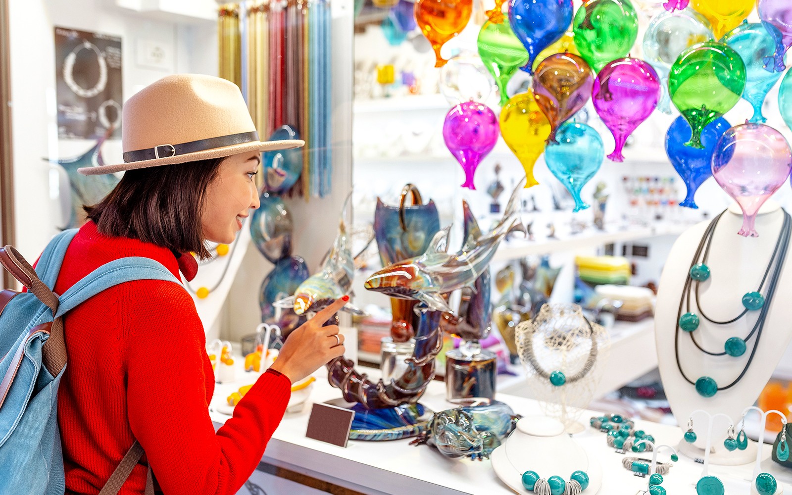 Murano glassblower crafting art piece, Burano's colorful houses in background, Venice day tour.