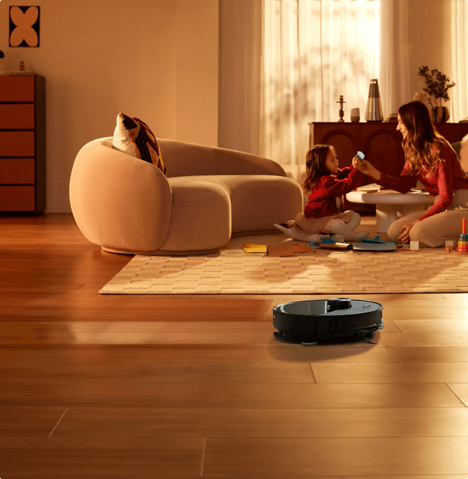A robot vacuum cleaning a hard floor in a living room