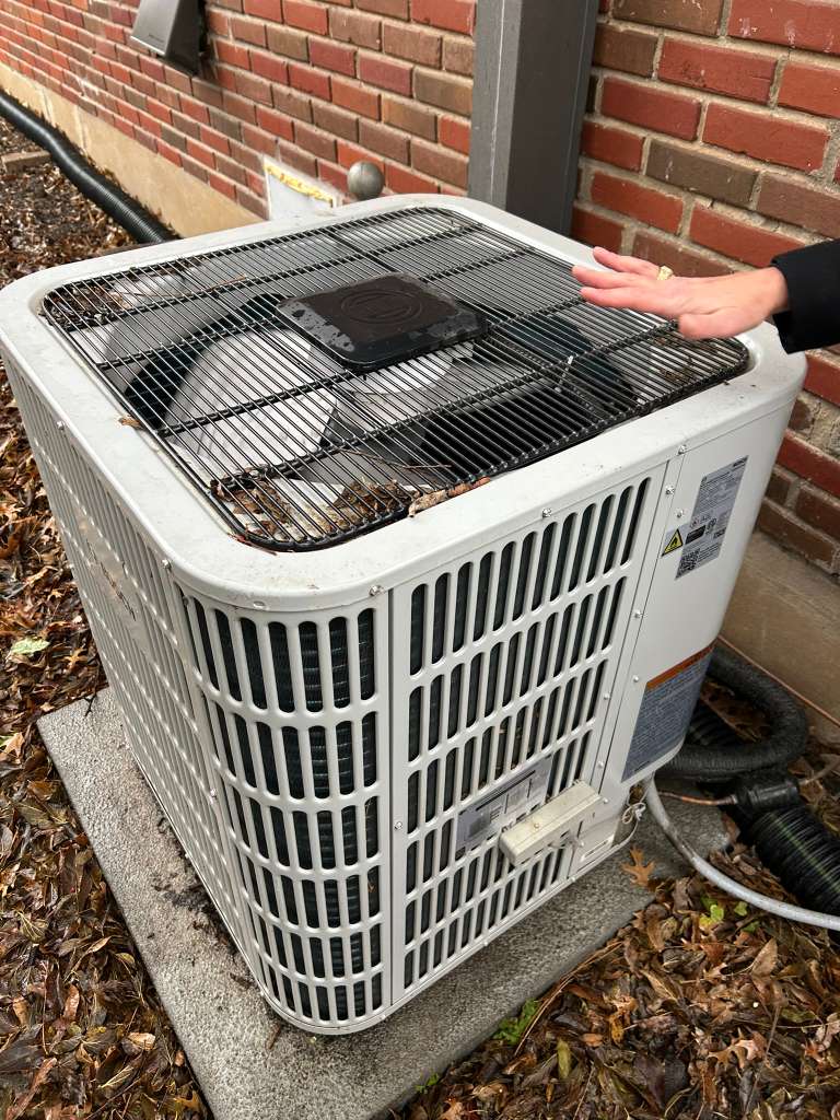 Evaluating HVAC system performance during a home comfort assessment in Dallas.